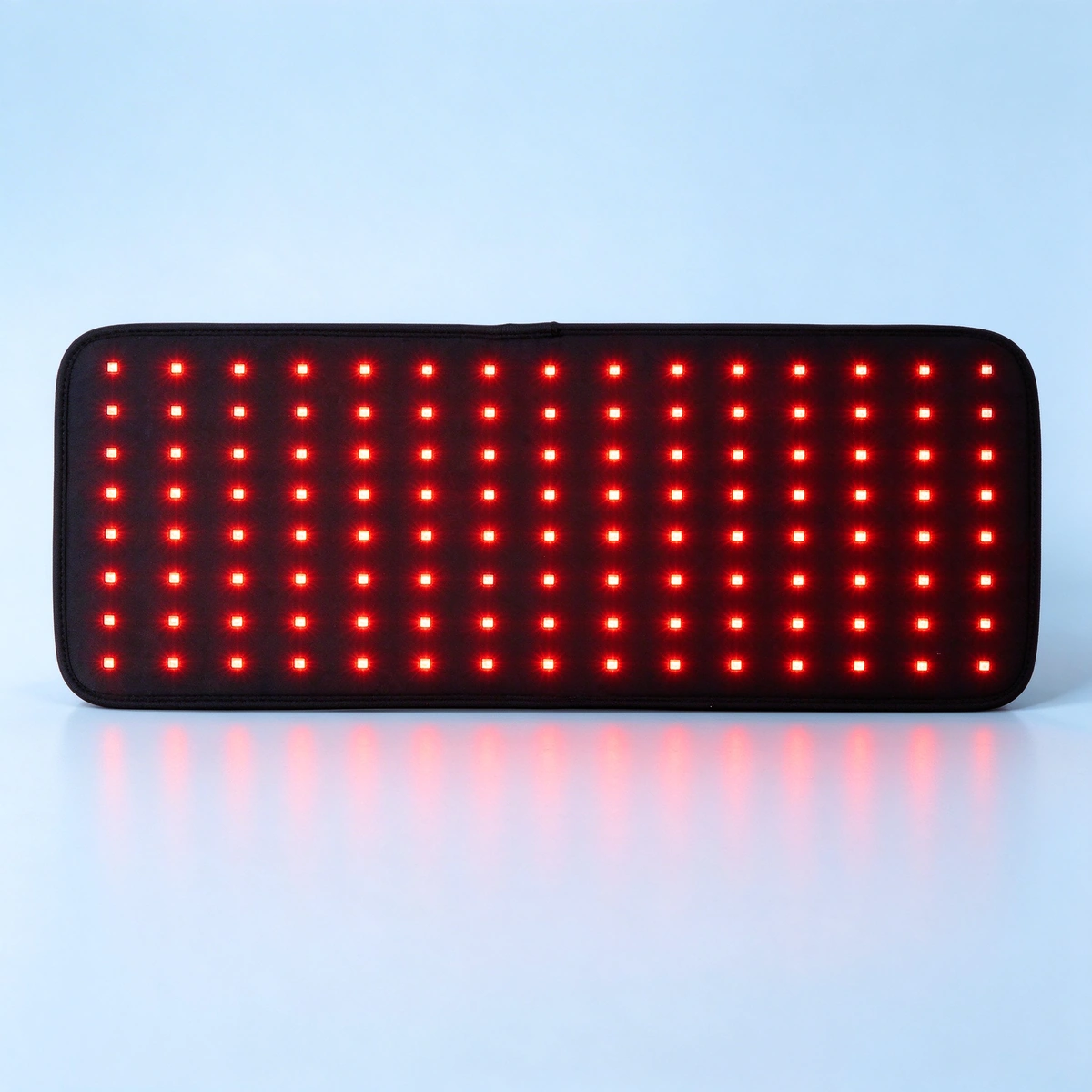 qcured d120 square red light therapy pad glowing